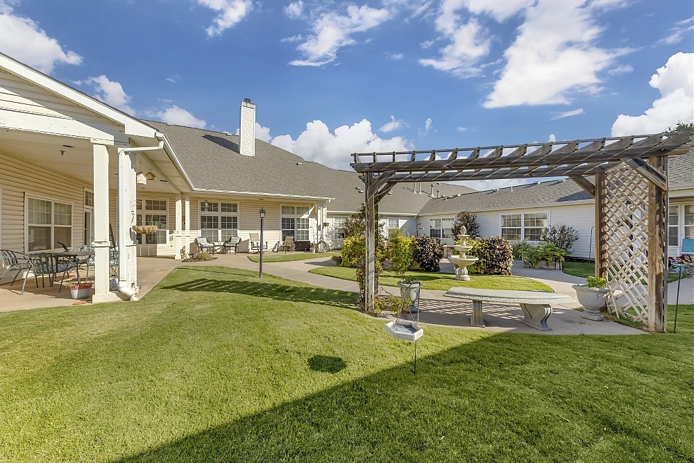 Outdoor garden area with seating and landscaping