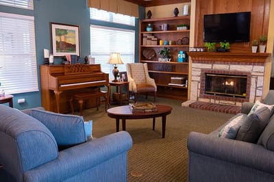 Cozy common area with seating and a fireplace