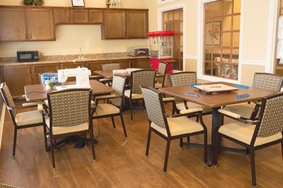 A common area with tables and seating for activities