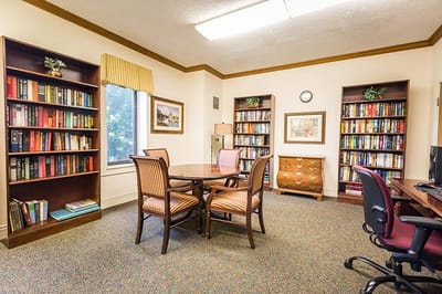 A cozy reading area with bookshelves and seating