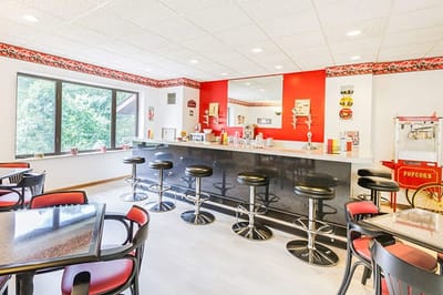 Bright dining area with a snack bar and seating