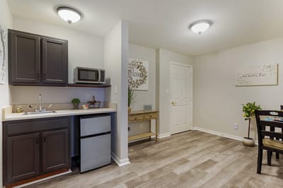 Interior view of a resident room with kitchenette