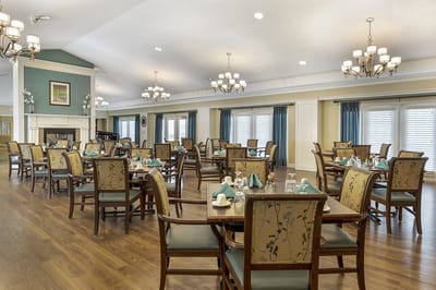 Bright dining area with well-set tables and chairs