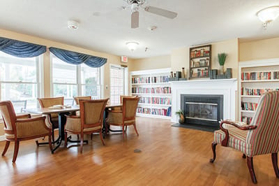 Bright common area with seating and bookshelves