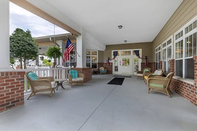 Outdoor seating area with comfortable chairs and plants