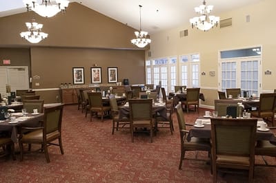 Dining room setup with tables and chairs