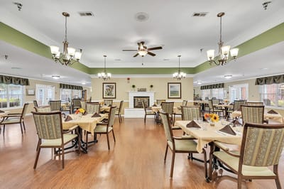 Bright dining room with tables set for meals.