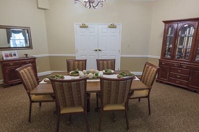 Dining room setup with a large table and chairs