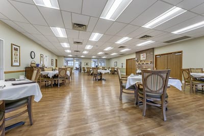Bright dining room with tables set for meals