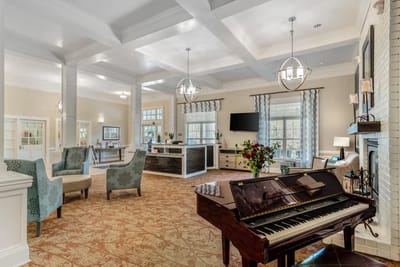 Interior common area with a piano and seating