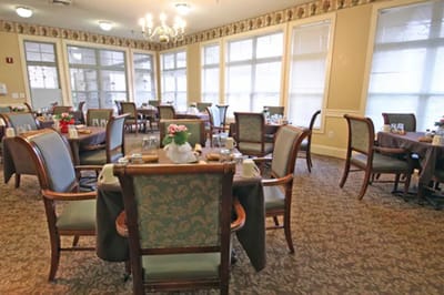 Dining area set up for meals with tables and chairs