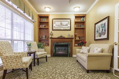 Cozy common area with seating and a fireplace