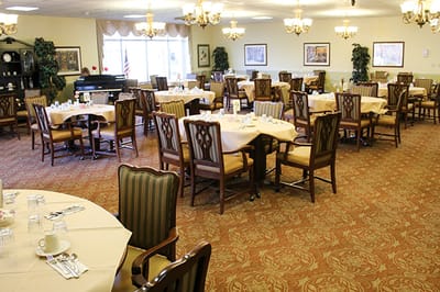 Dining room with tables set for residents