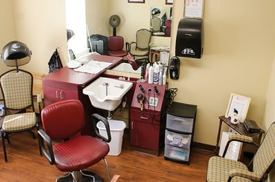 Salon area with hair styling equipment and chairs