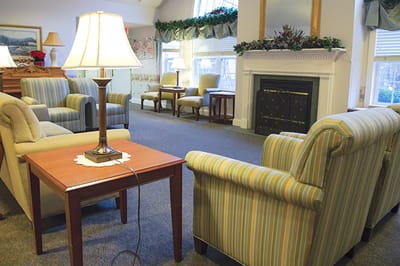 Interior common area with seating and a fireplace