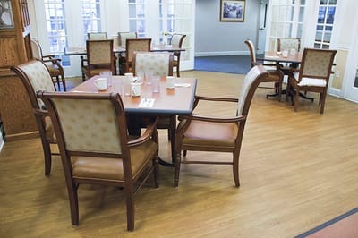 Dining room area with set tables and chairs