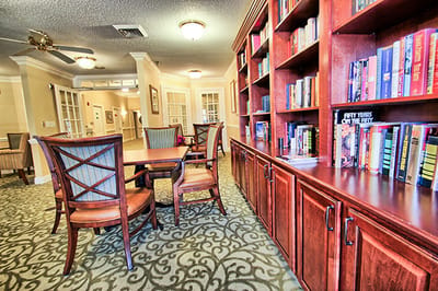 Cozy seating area with bookshelves in the common area