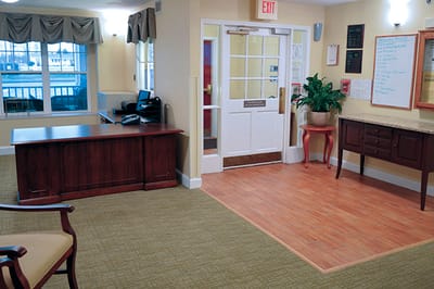 Interior lobby area with furniture and entrance door