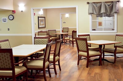 Interior view of a dining room with tables and chairs