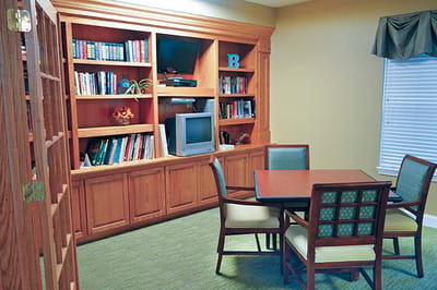 Cozy common area with bookshelves and seating