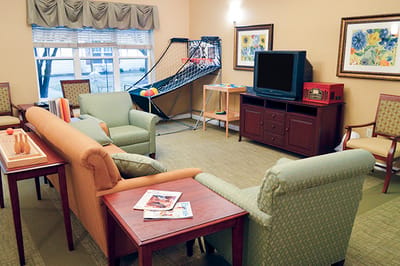 Bright common area with seating and activities