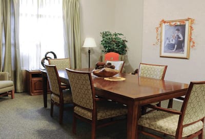 Cozy common area with a dining table and artwork