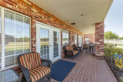 Outdoor seating area with tables and chairs