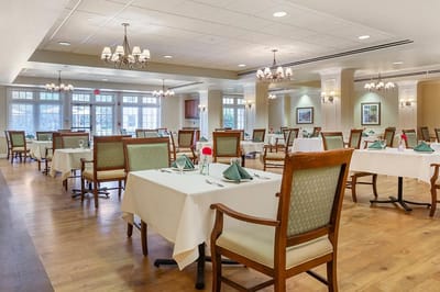Bright dining room set with tables and chairs