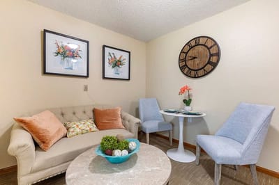 Cozy sitting area with artwork and clock
