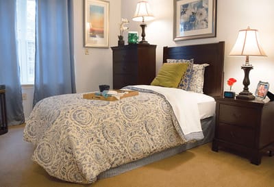Cozy resident room with bed and furnishings