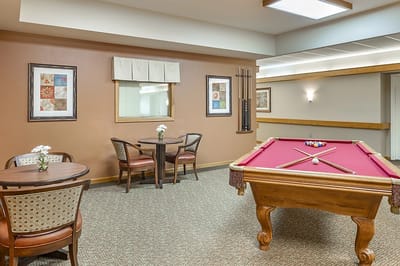 Common area with a pool table and seating