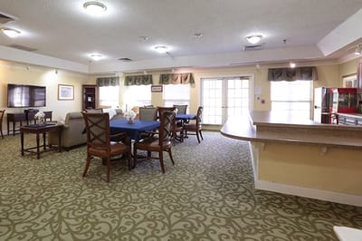 Bright common area with seating and television