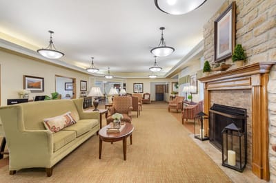 Bright common area with seating and fireplace