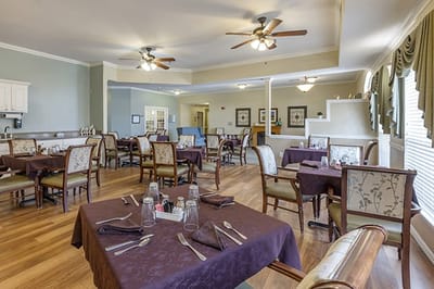 Interior view of a dining room with tables set
