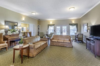 Cozy common area with seating and piano