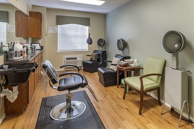 Interior view of a salon area with styling chairs and equipment