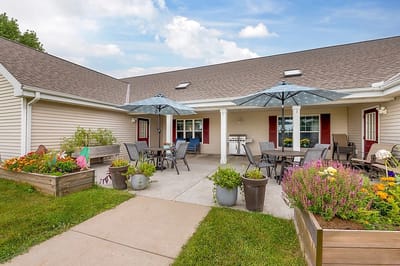 Outdoor patio area with tables and umbrellas