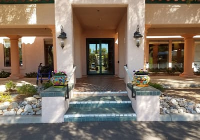 Entrance area of a senior living facility with decorative pots