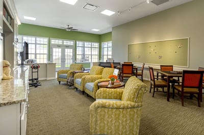 Bright common area with seating and tables