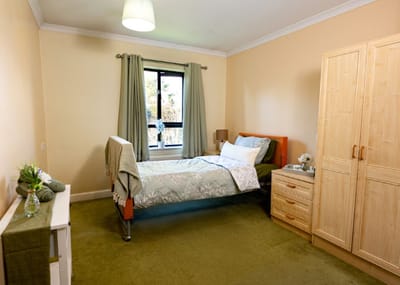 Cozy private resident room with bed and storage