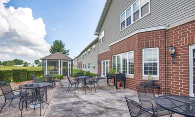 Outdoor seating area with tables and a gazebo