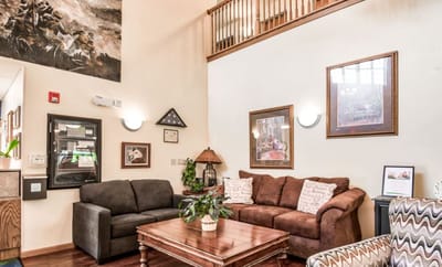 Common area with seating in a warm, inviting lobby