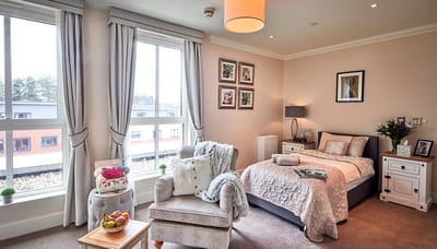 Cozy resident room with bed and seating area