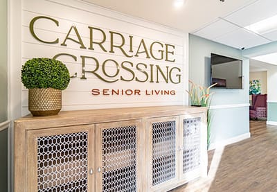 Interior view of Carriage Crossing Senior Living signage