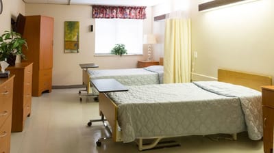 Interior view of a shared resident room with beds