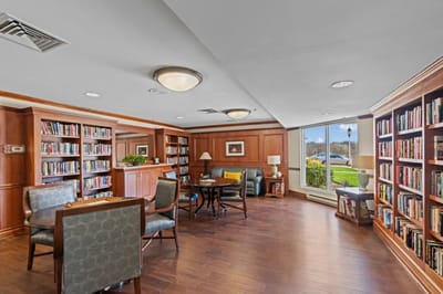 Cozy library area with bookshelves and seating