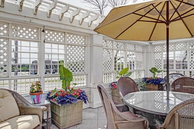 Outdoor patio area with plants and seating