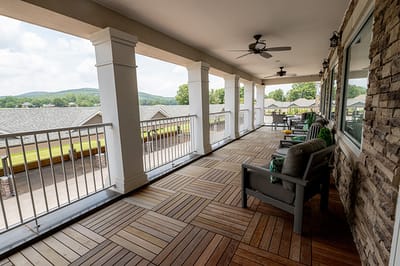 Outdoor balcony area with seating and scenic views