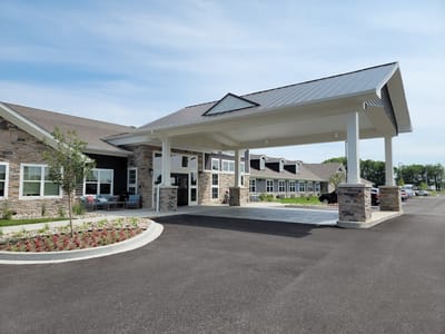 Charter Senior Living of White House, assisted living in White House, TN — Entrance of a senior living facility with landscaped gardens