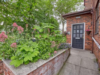 Entrance pathway with garden at Chestnut House Care Home